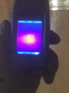 A thermal imaging camera shows a read